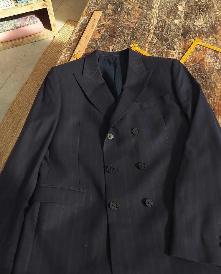 TILLI seamstresses upcycle and transform your blazer by creating cut-outs.