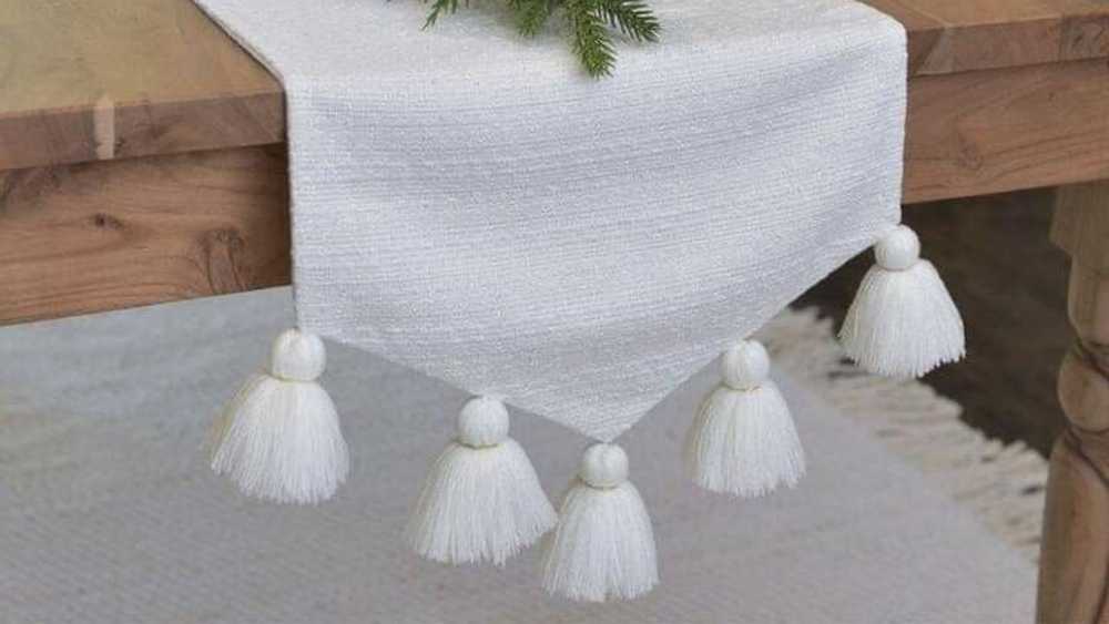 TILLI craftsmen personalize your linens with tassels