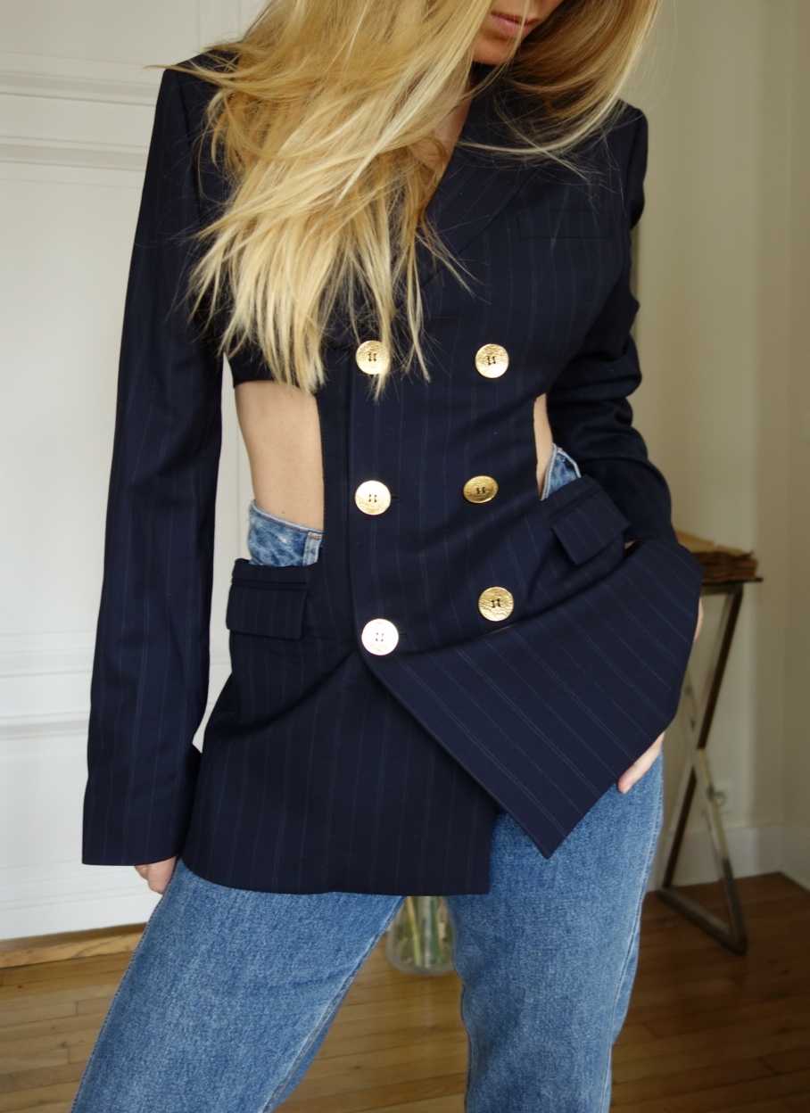 TILLI seamstresses upcycle and transform your blazer by creating cut-outs.