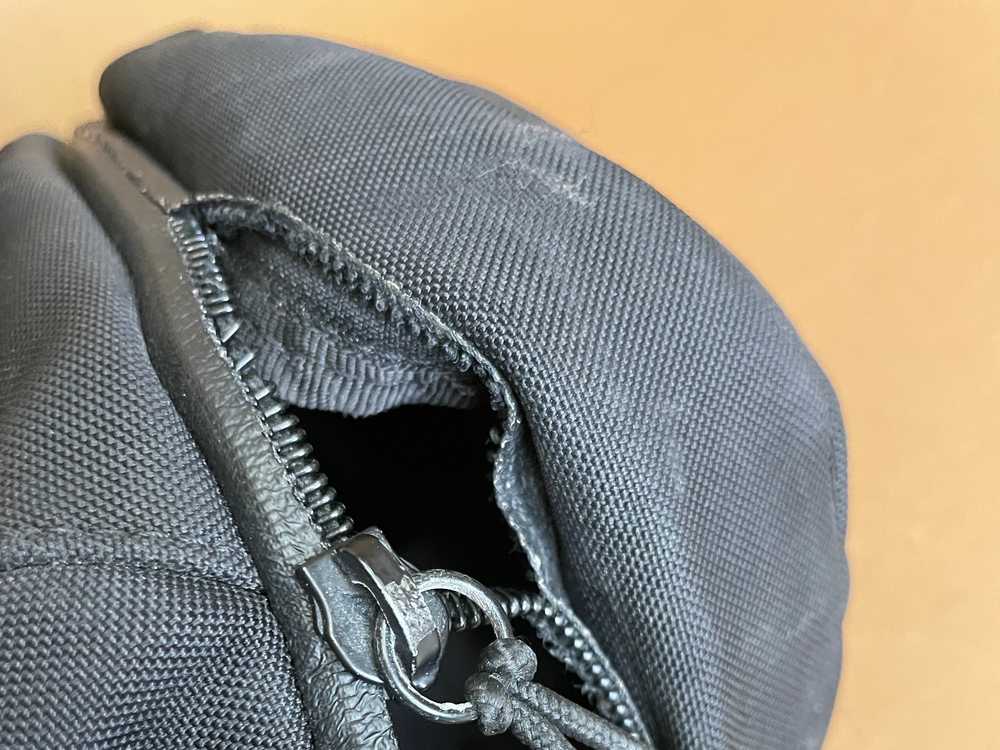 TILLI artisans repair the zip on your rucksack